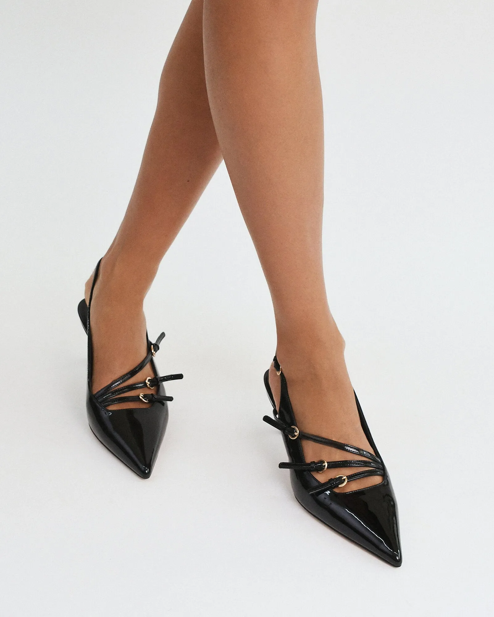 REVOLVE MID HEELS BLACK PATENT